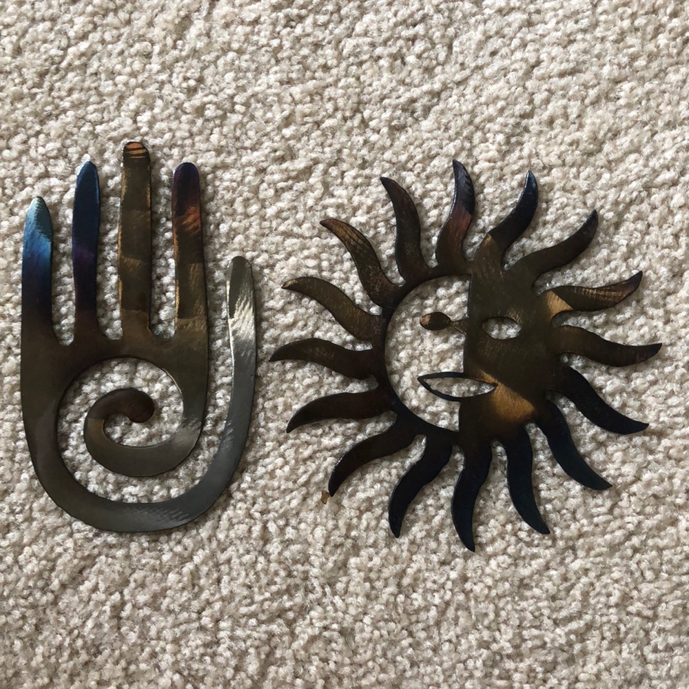 A sun and a hand: wall hanging decorations
